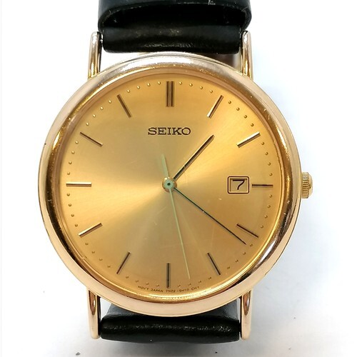 Seiko 9ct gold cased gents date quartz watch - 33mm diameter... at auction  | LOT-ART