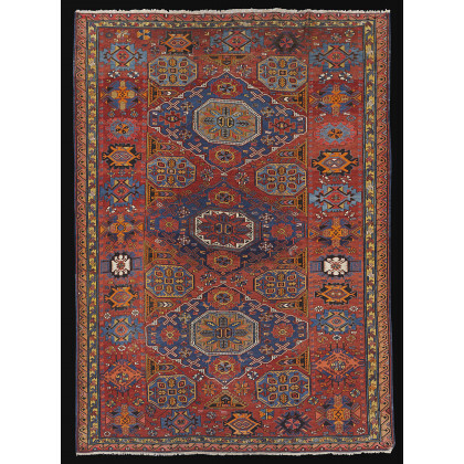 Sumak carpet, Caucasus, early 20th century. Decorated with three rhomboidal medallions in shades of blue, orange, brown, light blue, yellow...