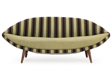 Swedish design: Freestanding two seater “Eye” sofa with legs of stained beech. Upholstered with green/brown striped wool, seat with green wool.
