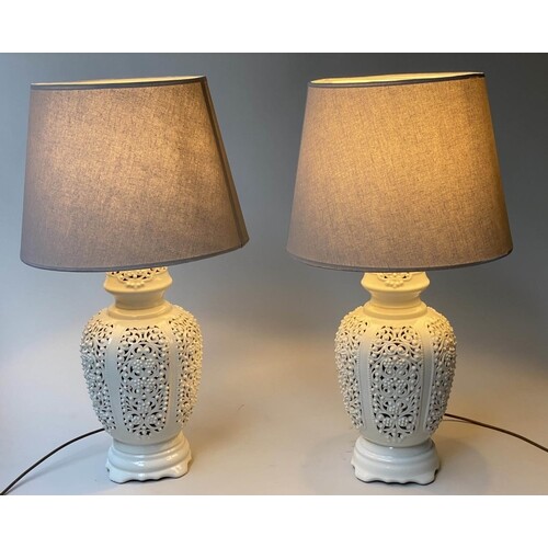 TABLE LAMPS, a pair, reticulated white ceramic of vase form ...