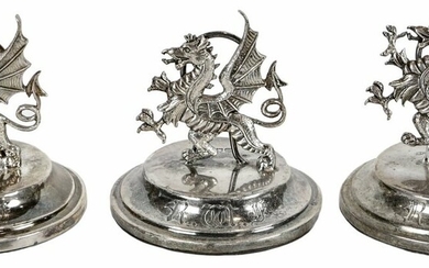Three silver Royal Welsh Fusiliers menu-card or place-card holders, 1907-08. In the form of th...