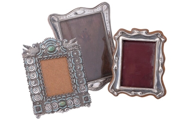Three silver or silver coloured photograph frames