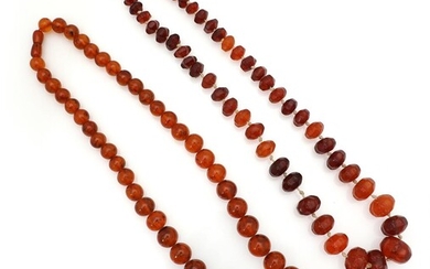 SOLD. Two graduated necklaces respectively set with numerous polished and faceted amber beads with a clasp of metal. L. app. 65 and 67 cm. (2) – Bruun Rasmussen Auctioneers of Fine Art