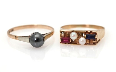 SOLD. Two rings one set with a baguette-cut ruby and sapphire and two cultured pearls and one set with a hematite bead, each mounted in 14k gold. Size 56 and 57. (2) – Bruun Rasmussen Auctioneers of Fine Art