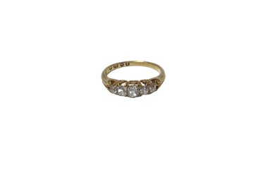 Victorian diamond five stone ring with five old cut diamonds in carved gold claw setting with scroll shoulders on tapered shank, London 1865. Estimated total diamond weight approximately 0.50cts. R...