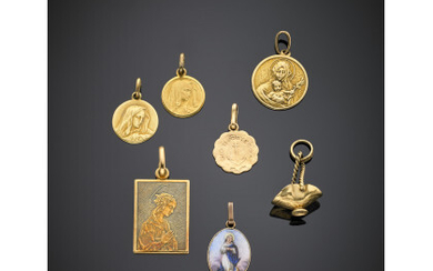 Yellow gold lot comprising six medals with a holy subject and a basket charm, in all g 14.26.Read more