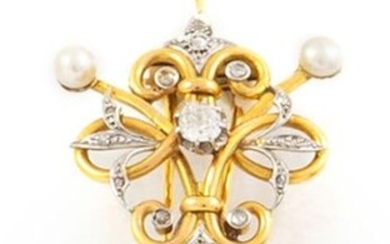18K yellow gold and platinum brooch decorated with scrolls holding...