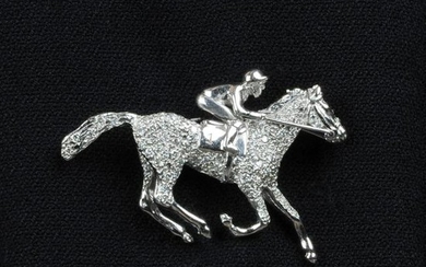 An 18ct gold diamond horse and jockey brooch.Engraved