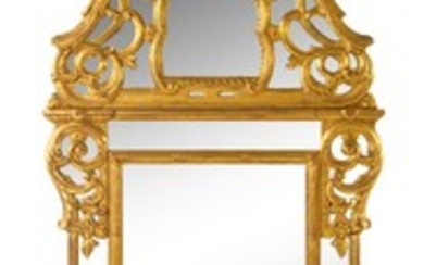 A Regence Style Giltwood Mirror Height 62 inches.