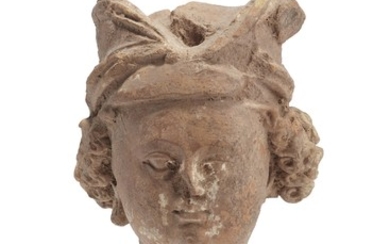 A TERRACOTTA HEAD OF A YOUTH, ANCIENT REGION OF GANDHARA, 4TH-5TH CENTURY