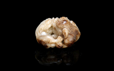 A white and mottled brown jade 'Buddhist lion' group