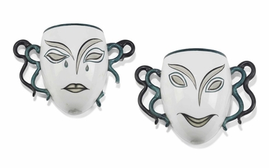 A PAIR OF PAINTED AND MILK GLASS MASK WALL ORNAMENTS, CIRCA 1930-40