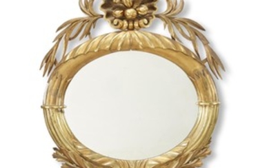 A classical style round gilt wood and gesso mirror...