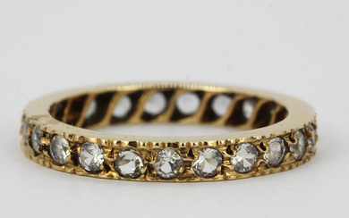 9CT AND WHITE STONE FULL ETERNITY RING.