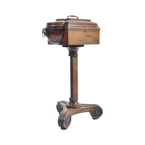 A 19th century Regency teapoy / caddy on stand. Raised on a ...