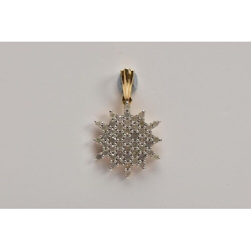 A 9CT GOLD DIAMOND PENDANT, of a snowflake outline, set with...