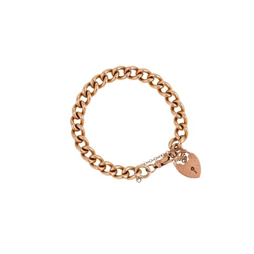 A 9CT YELLOW GOLD HEAVY CURB LINK BRACELET, with padlock, 40...