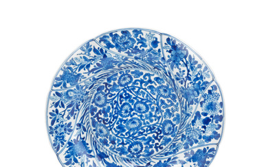 A BLUE AND WHITE SPIRAL MOULDED PLATE Kangxi