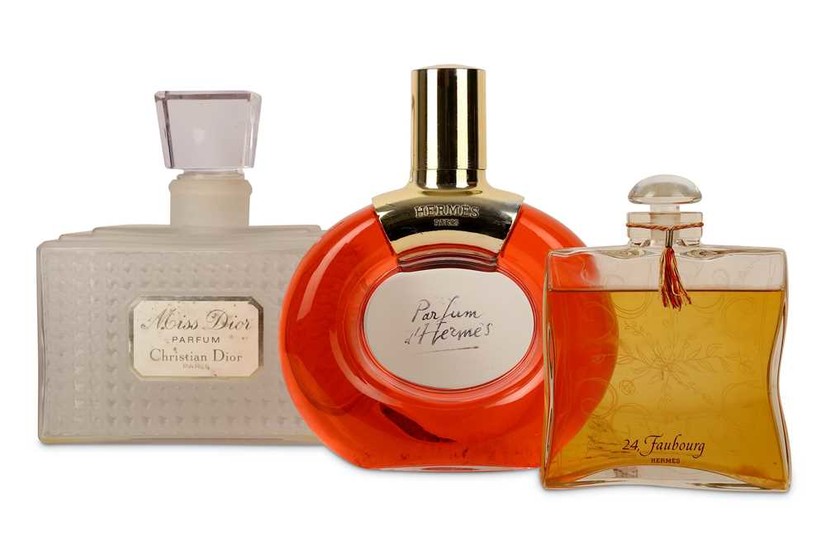 A COLLECTION OF THREE OVER-SIZED GLASS PERFUME BOTTLES