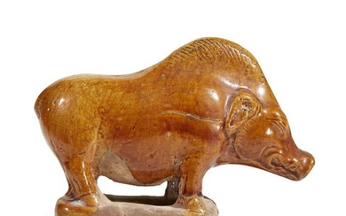 "A Chinese amber-glazed pottery figure of a boar