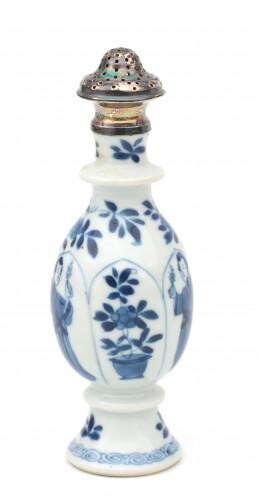 A Chinese blue and white porcelain caster decorated with figures and stylized flower motifs in cartouches and a silver caster mount of later date, Kangxi.