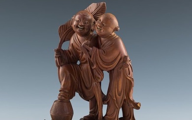 A Chinese carved wood He-He Er Xian statue, late 19th century
