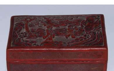 A Chinese cinnabar lacquer rectangular box and cover, carved...