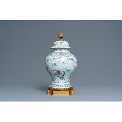 A Chinese famille rose vase and cover with gilt bronze mount...