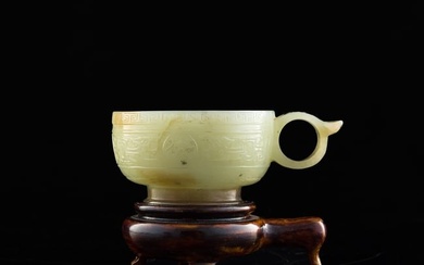 A Chinese jade-handled cup with carved 'taotie' motif, Ming dynasty