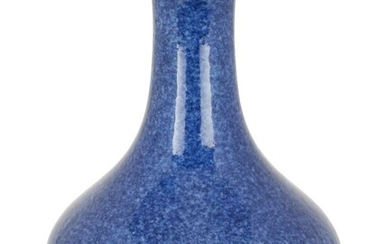 A Chinese monochrome powder-blue bottle vase, Yongzheng mark and of the period, the gently flared short foot supporting a compressed globular body, the exterior covered in a mottled blue glaze, underglaze blue six-character Yongzheng mark within...