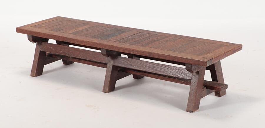 A FRENCH OAK BENCH OF ARCHITECTURAL FORM