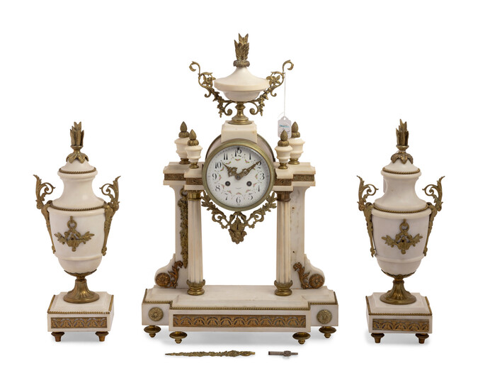 A French Gilt Metal Mounted Marble Three-Piece Clock Garniture