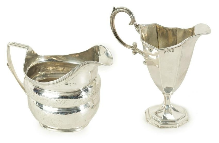 A GEORGE III SILVER MILK JUG OF OBLATE FORM