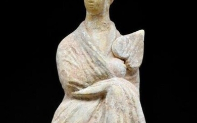 A GREEK BOETIAN TERRACOTTA TANAGRA OF A DRAPED WOMAN