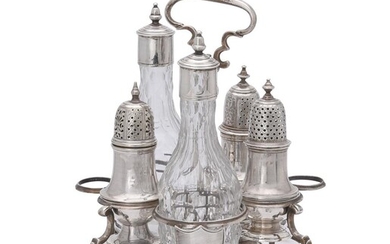 A George II silver Warwick cruet stand with associated bottles and casters