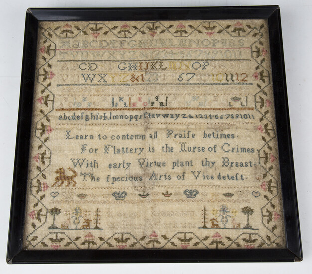 A George III needlework sampler by Louisa Losecamp, dated 1806, worked in coloured silks within a st