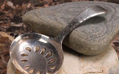 A George III silver caddy spoon, oval pierced bowl, wriggle-...