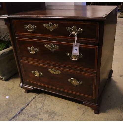 A George III style mahogany small chest, incorporating old t...