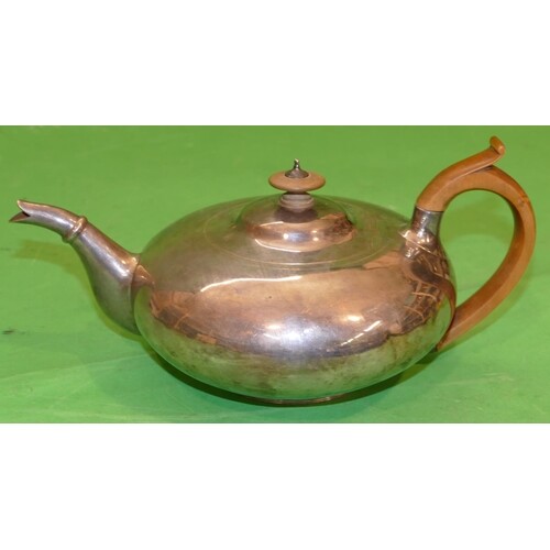 A George IV Silver Bullet Shaped Teapot having engraved cres...