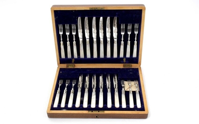 A George V electroplated cased set of twelve pairs of fruit/dessert knives and forks.