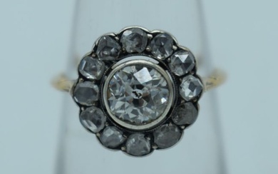 A LARGE ANTIQUE GOLD AND DIAMOND COCKTAIL CLUSTER RING. L. 2.3 grams. Central stone 0.5 cm x 0.5 cm.