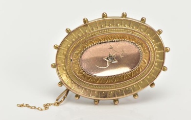 A LATE VICTORIAN BROOCH, of an oval form set...