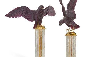 A PAIR OF CARVED RUBY, SAPPHIRE, DIAMOND, AND GOLD MODELS OF FALCONS PROBABLY SWITZERLAND, LATE 20TH CENTURY, RETAILED BY ASPREY, LONDON
