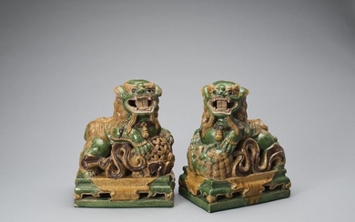 A PAIR OF RETICULATED SANCAI GLAZED POTTERY BUDDHIST...