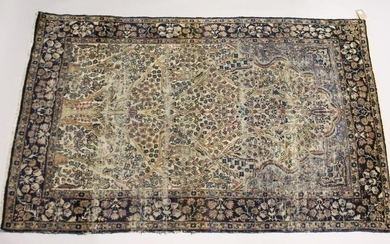 A PERSIAN KERMAN CARPET, cream groud with a stylised