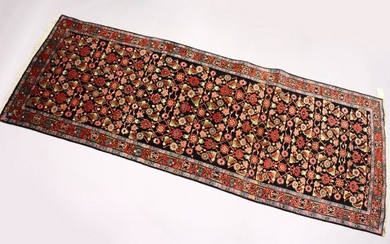 A PERSIAN MAHAL HALL CARPET, dark blue ground, with