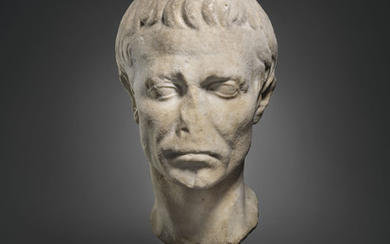 A ROMAN MARBLE PORTRAIT HEAD OF JULIUS CAESAR, AUGUSTAN PERIOD, CIRCA LATE 1ST CENTURY B.C.-EARLY 1ST CENTURY A.D.