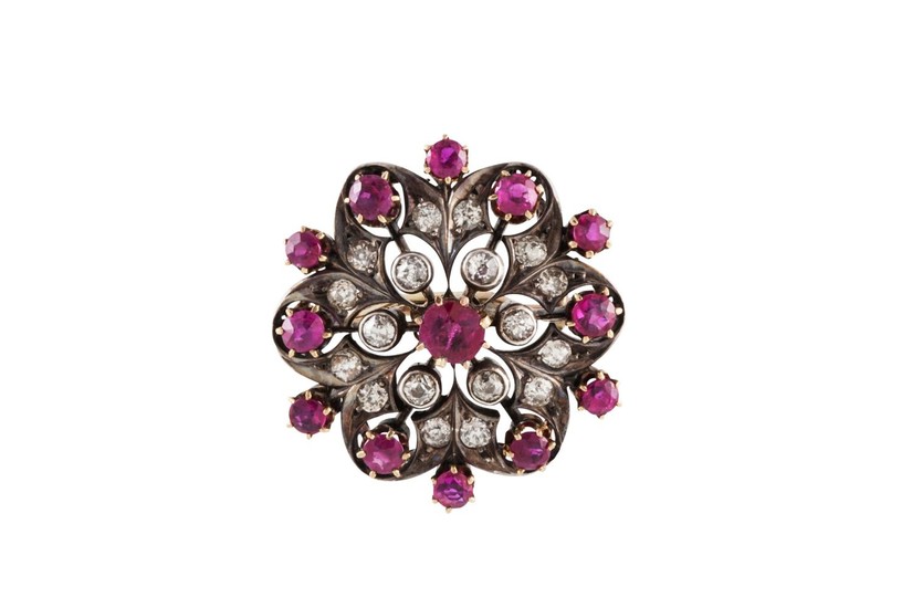 A RUBY AND DIAMOND FLOWER BROOCH, boxed, with rubies of 2.20...