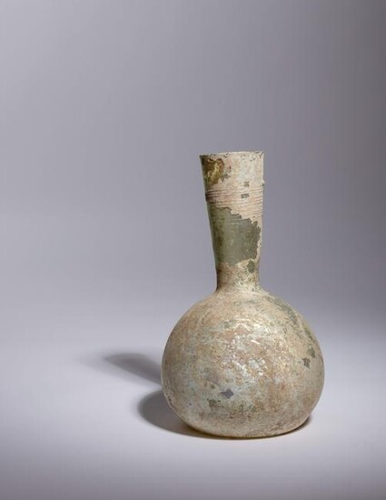A Roman Glass Bottle Height 8 7/8 inches.