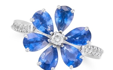 A SAPPHIRE AND DIAMOND FLOWER RING in 18ct white gold, set with a round brilliant cut diamond in a